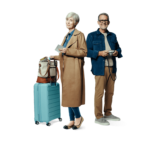 A middle-aged man and woman standing with a suitcase. Not actual patients.